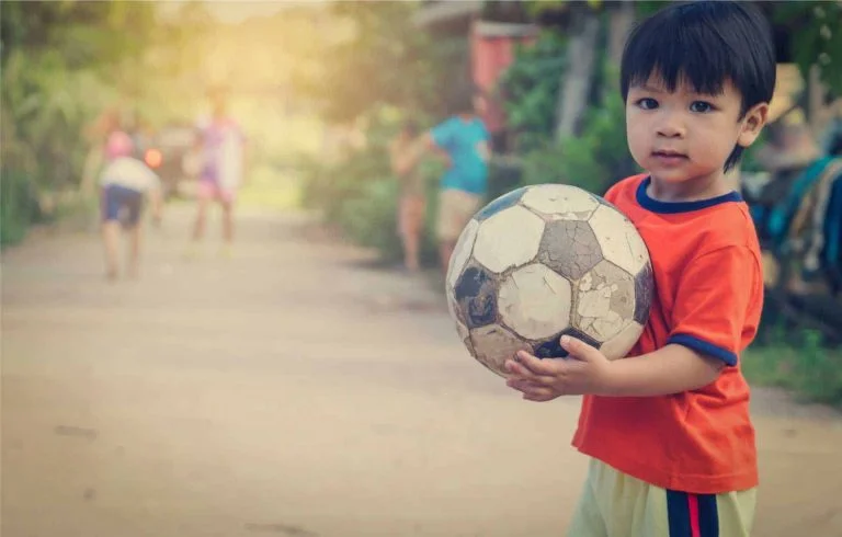 Boy with ball compressed