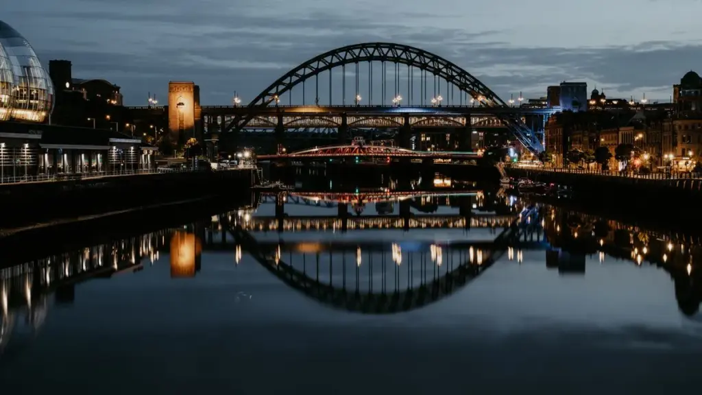 The Tyne Bridge reflected in the river at night, Newcastle upon Tyne