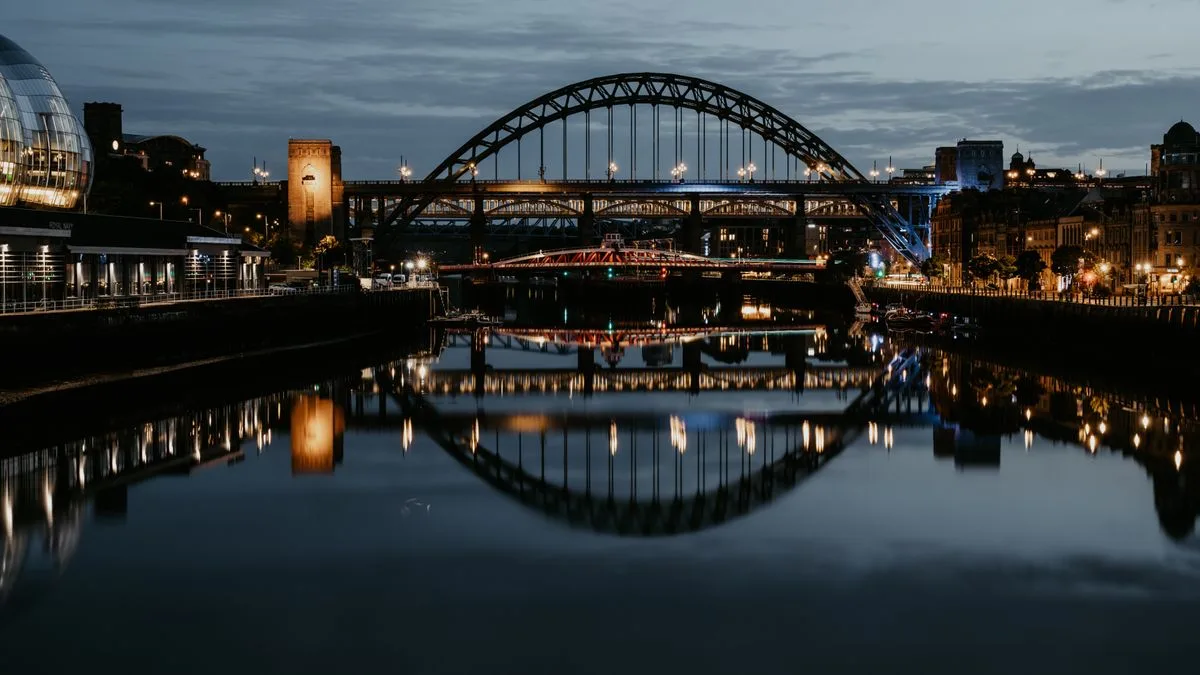 The Tyne Bridge reflected in the river at night, Newcastle upon Tyne