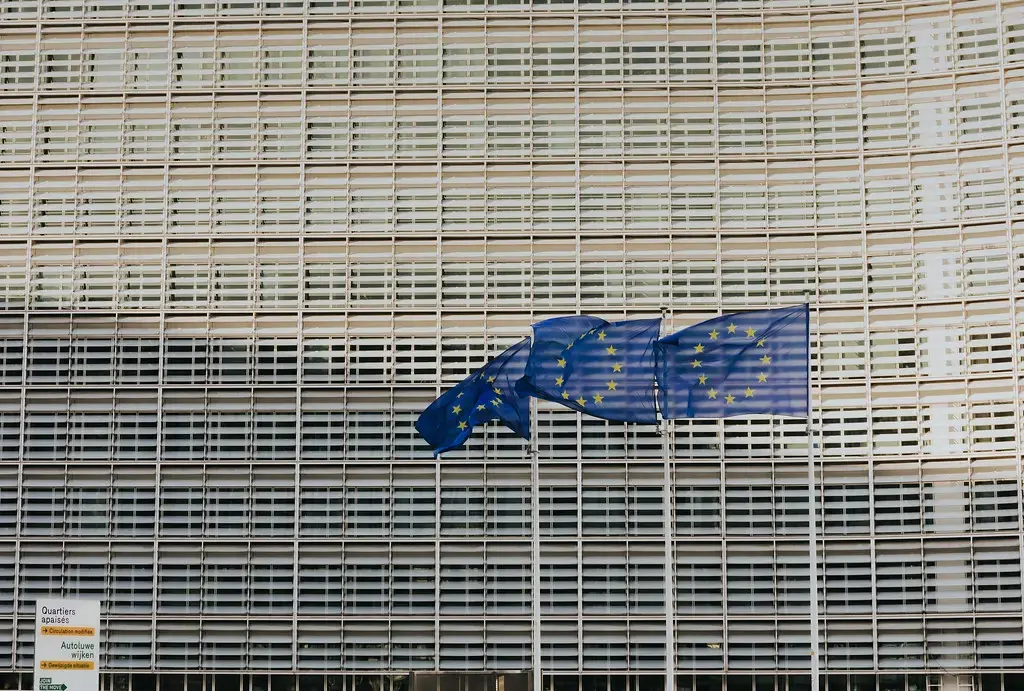 The Berlaymont building, headquarters of the European Commission, with EU flags in front